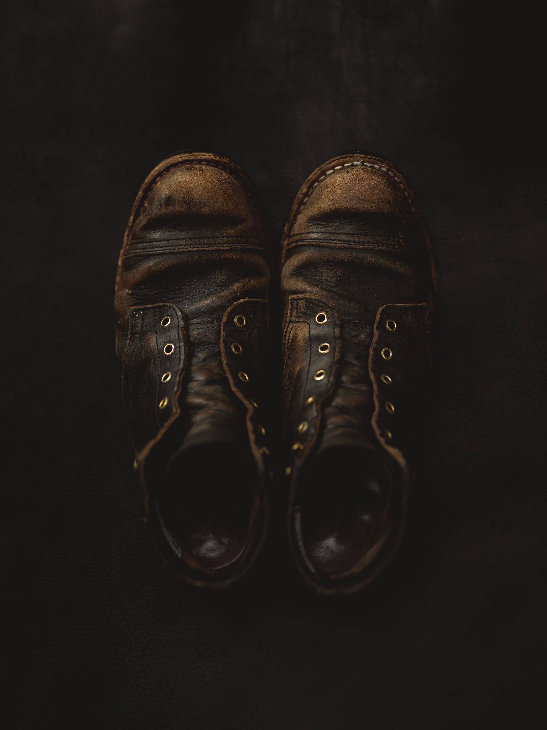 pair of truman boots in black teacore worn in with heavy patina